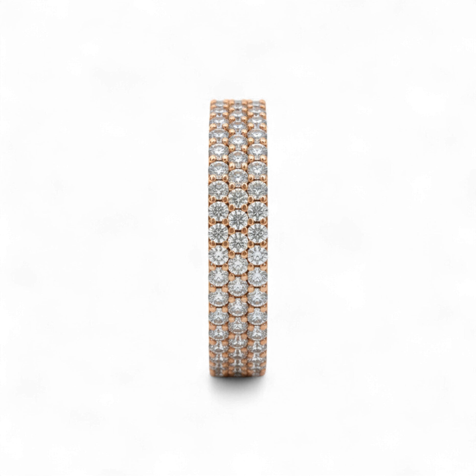 Rose gold and silver eternity ring with diamonds on a white background