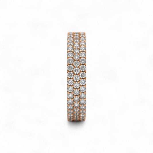 Rose gold and silver eternity ring with diamonds on a white background