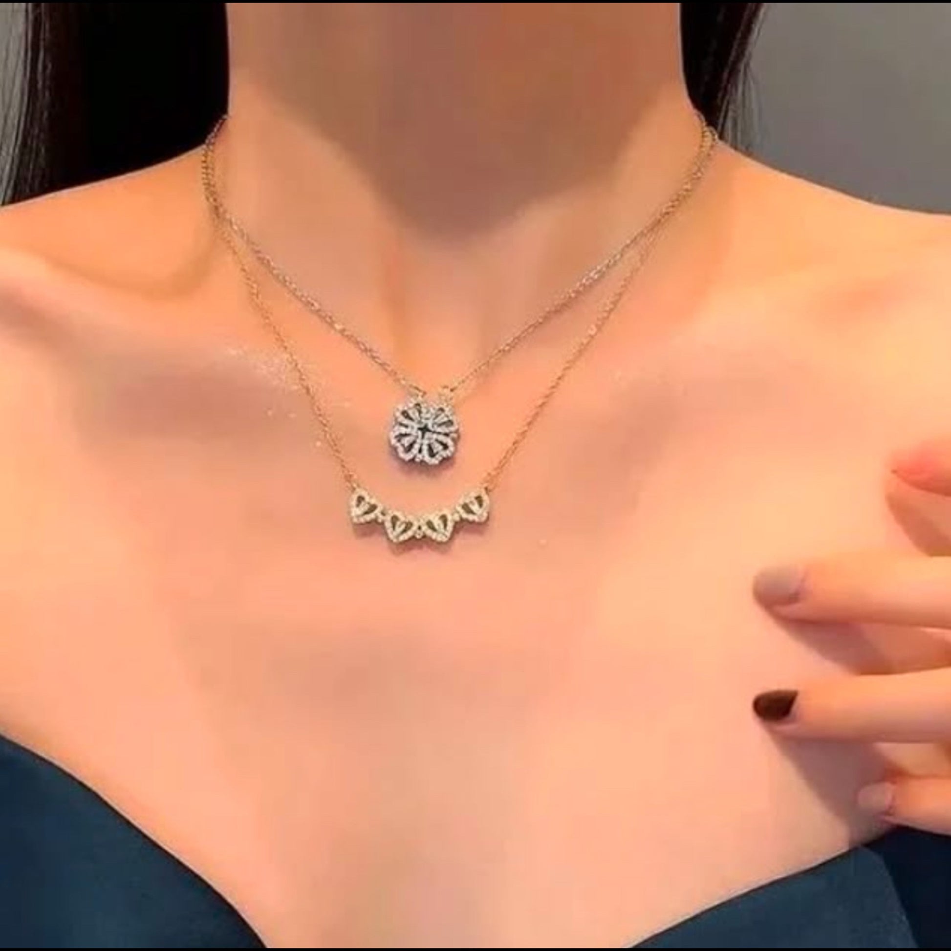 Necklace with a heart-shaped pendant worn by a person