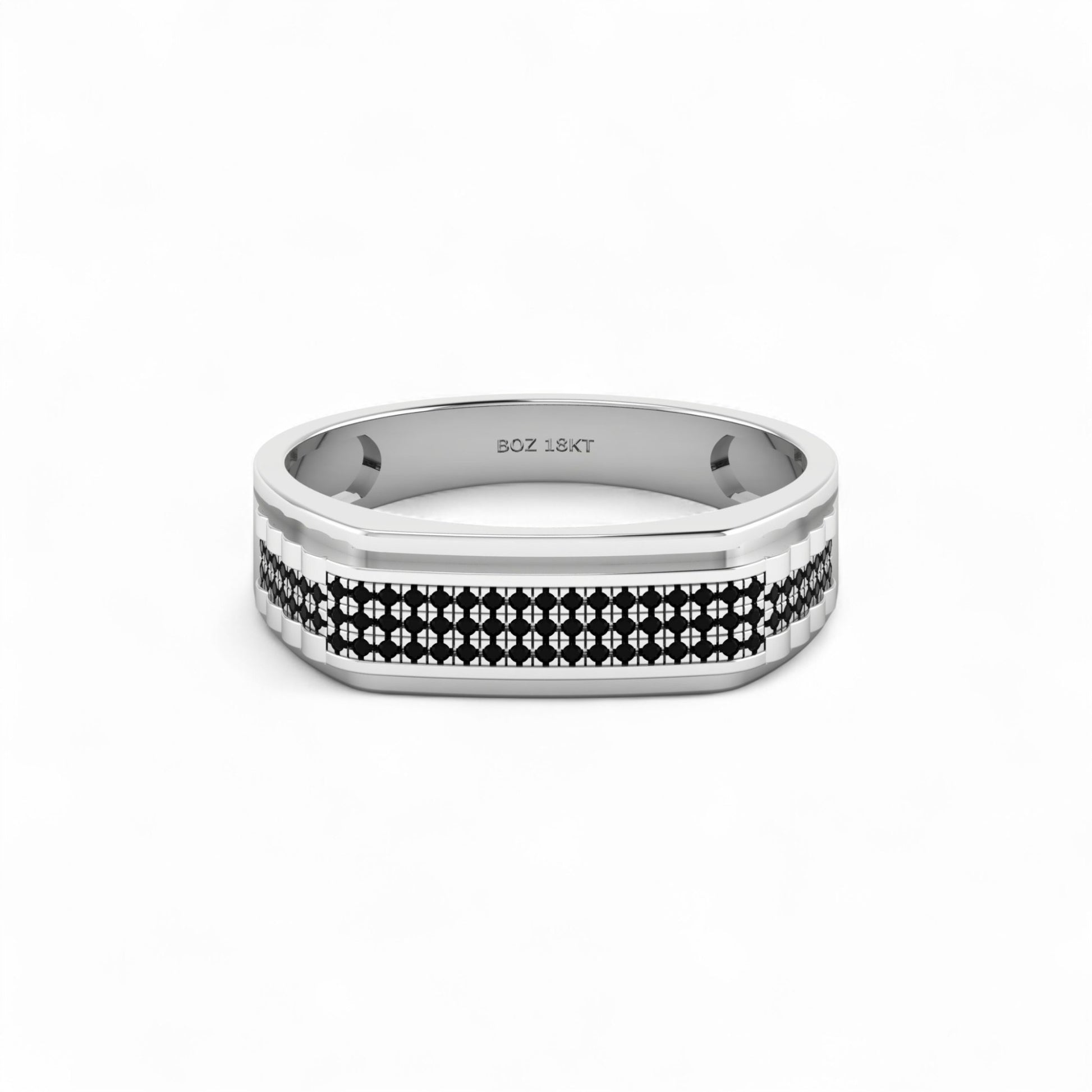 Silver ring with black and white pattern on a white background