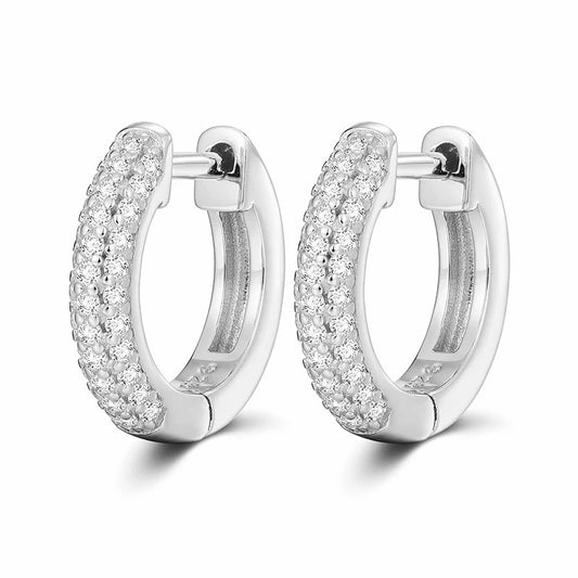 Pair of silver hoop earrings with clear gemstones on a white background