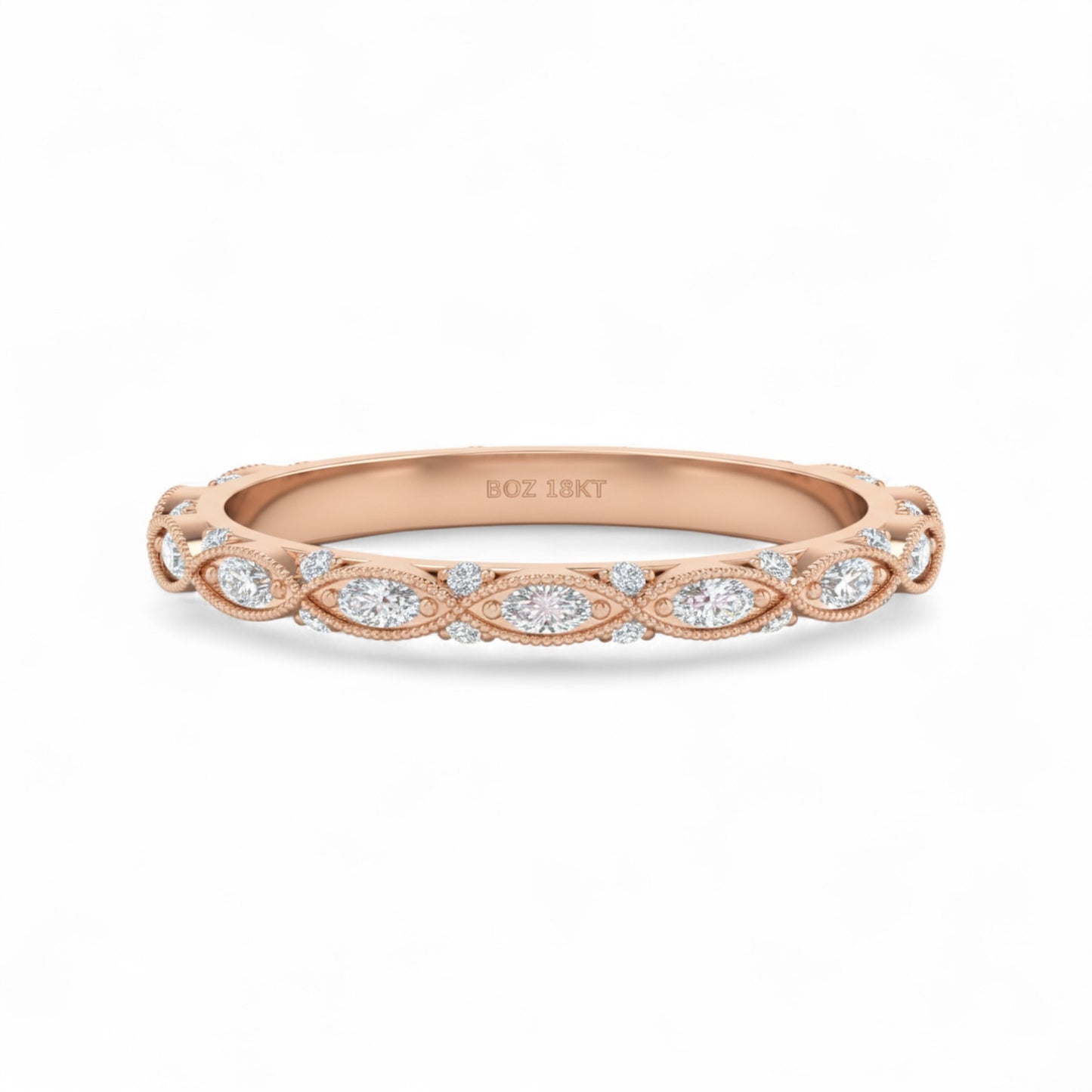 Rose gold ring with diamond accents on a white background