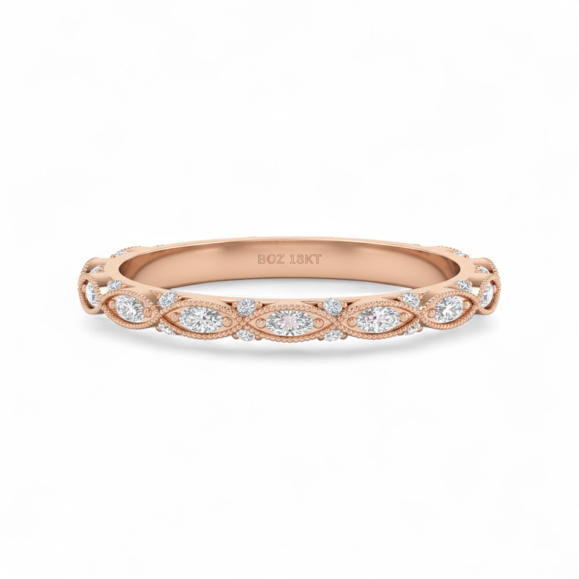 Rose gold ring with diamond accents on a white background