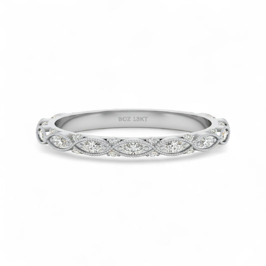 Silver ring with diamond accents on a white background