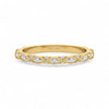 Gold ring with diamond accents on a white background