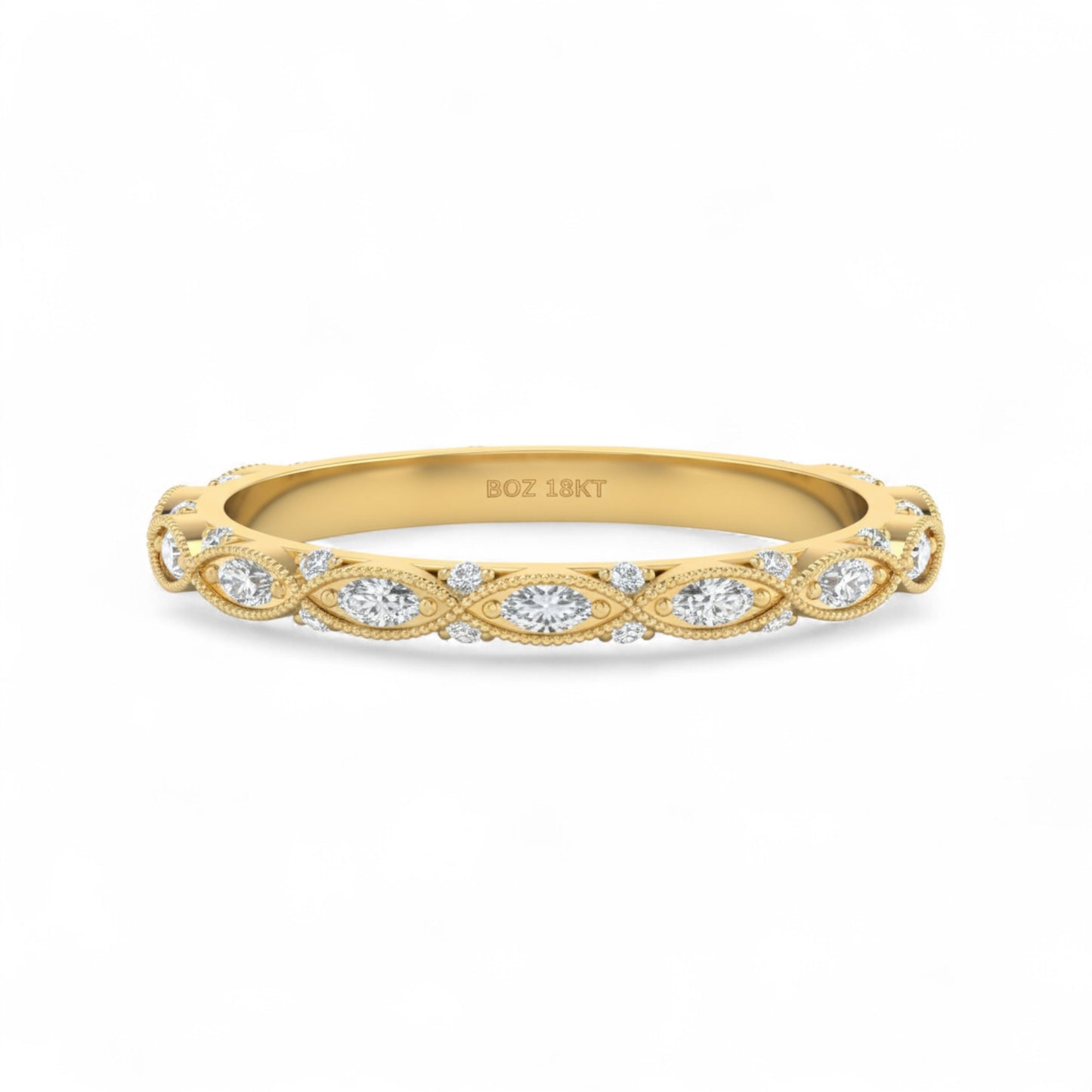 Gold ring with diamond accents on a white background