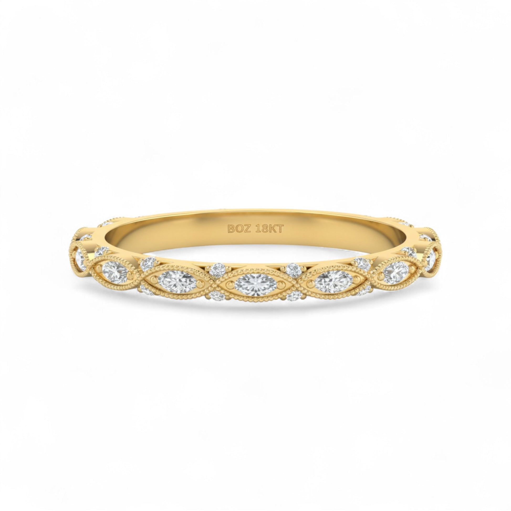 Gold ring with diamond accents on a white background