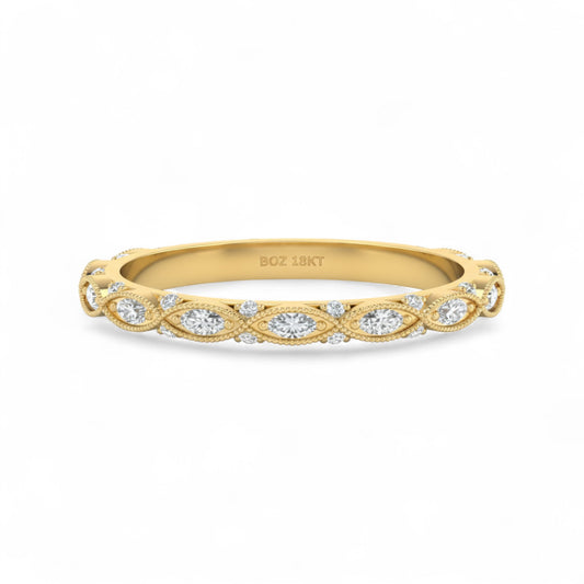 Gold ring with diamond accents on a white background