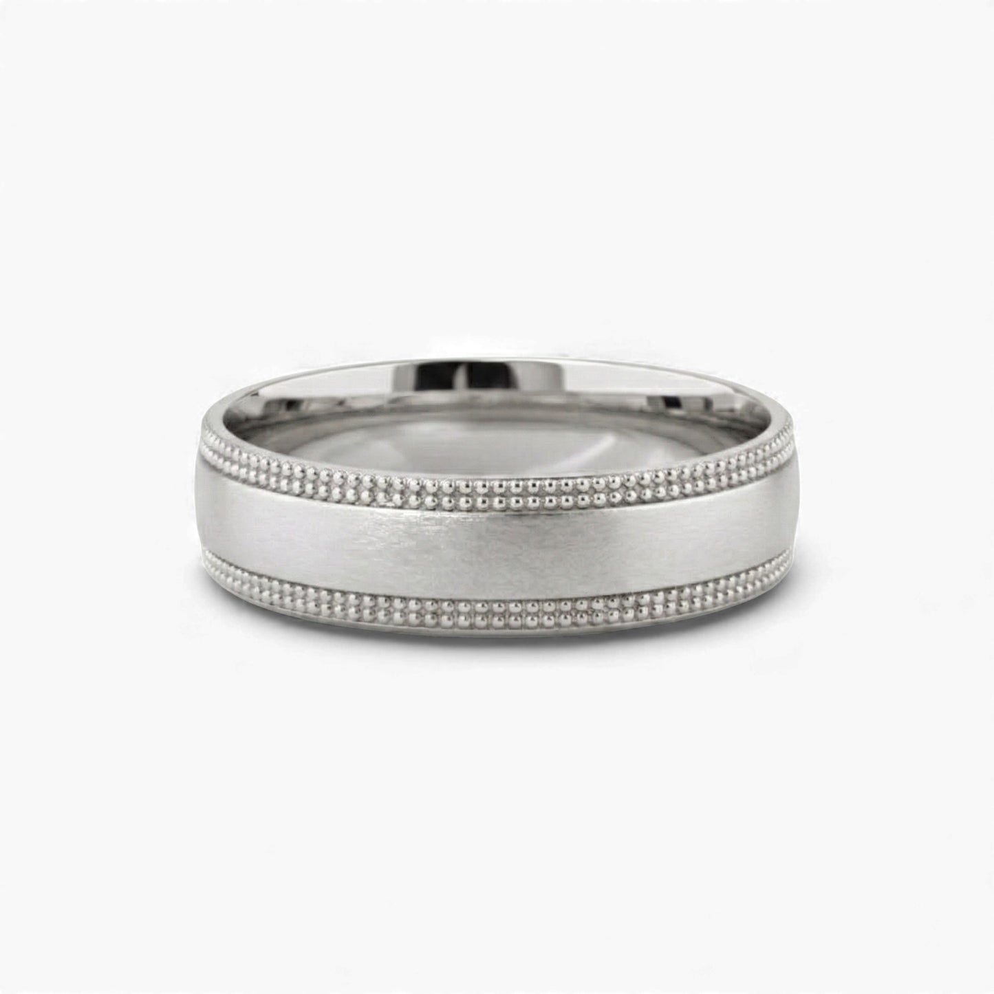 Silver ring with beaded design on a white background