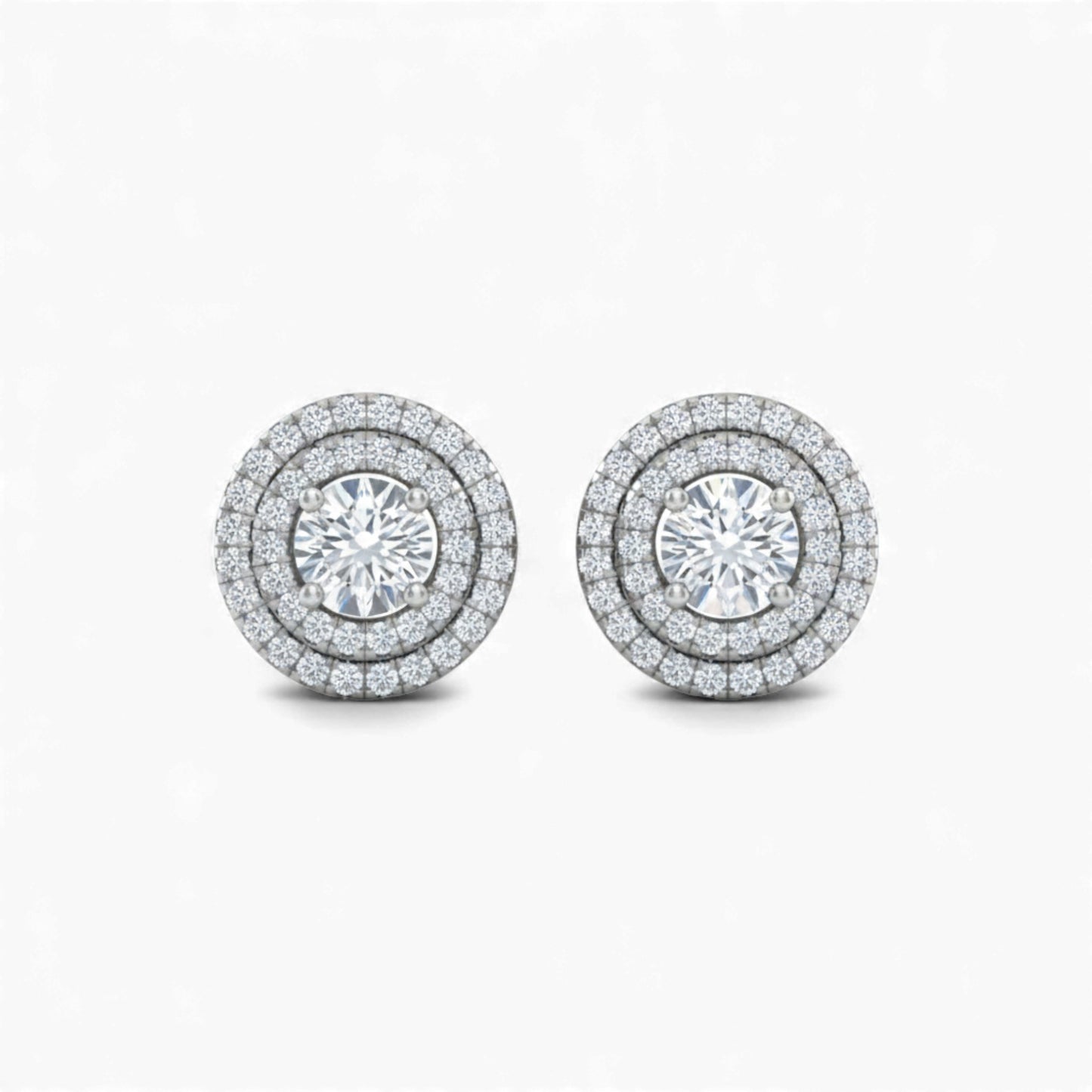 Pair of diamond stud earrings on a white background