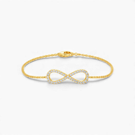 18KT gold infinity natural diamond bracelet with pavé-set round brilliant diamonds and adjustable cable chain clasp