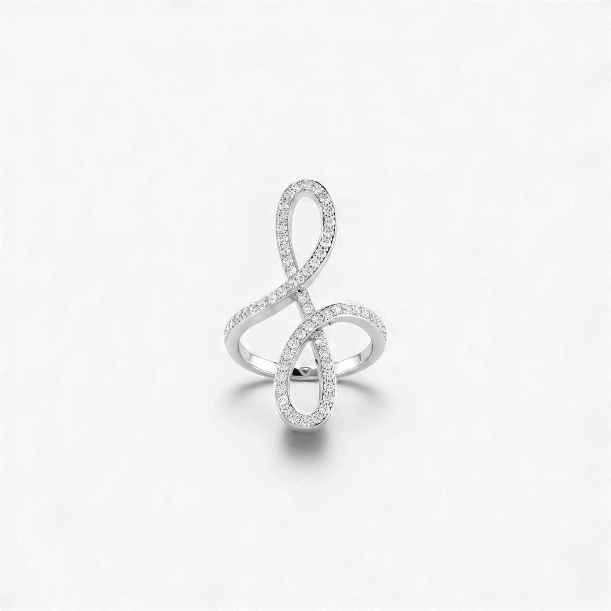 Silver ring designed like a music note on a white background