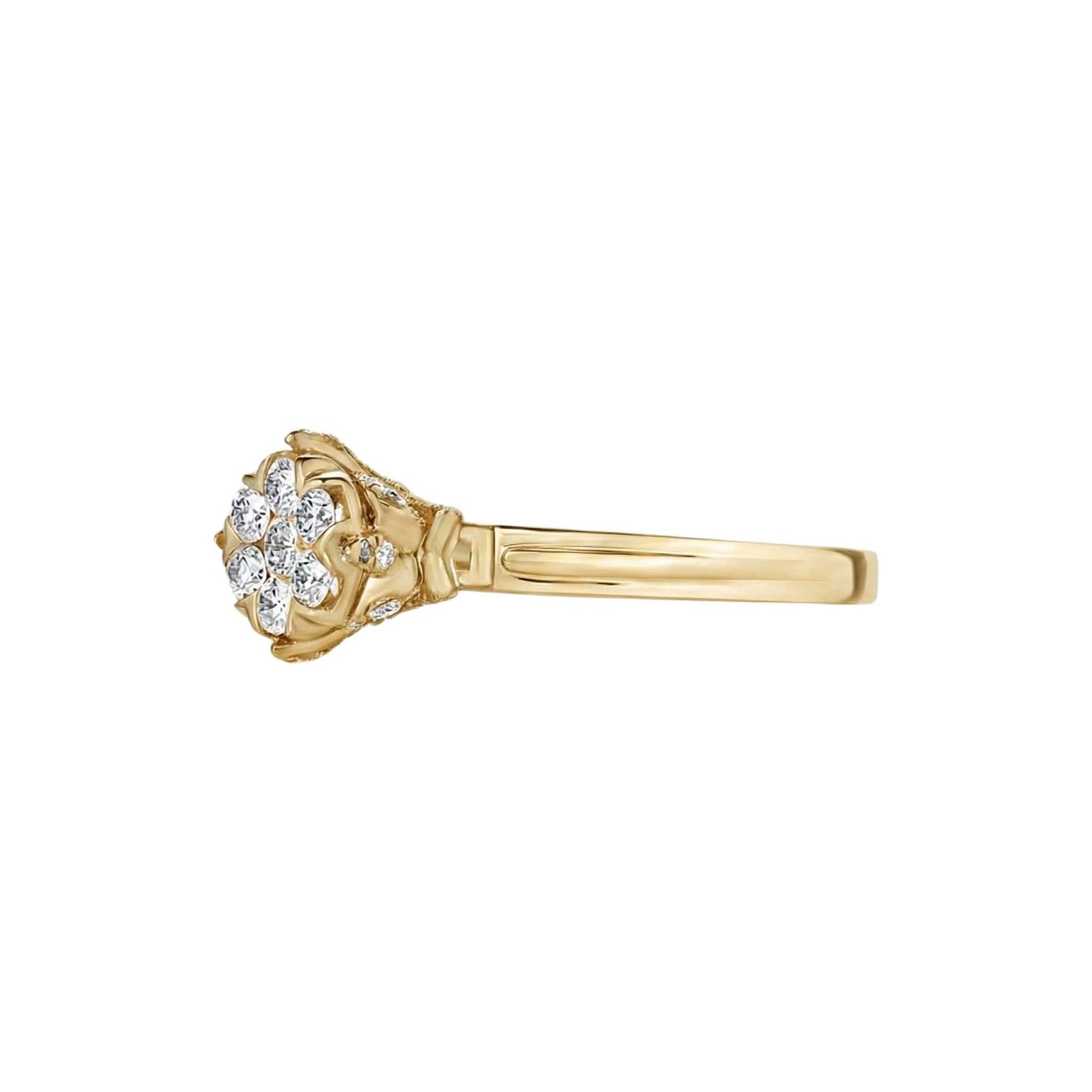 Gold ring with diamond accents on a white background