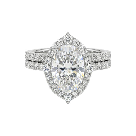 Diamond ring with a pear-shaped center stone on a white background