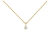 Gold necklace with a diamond pendant on a white background