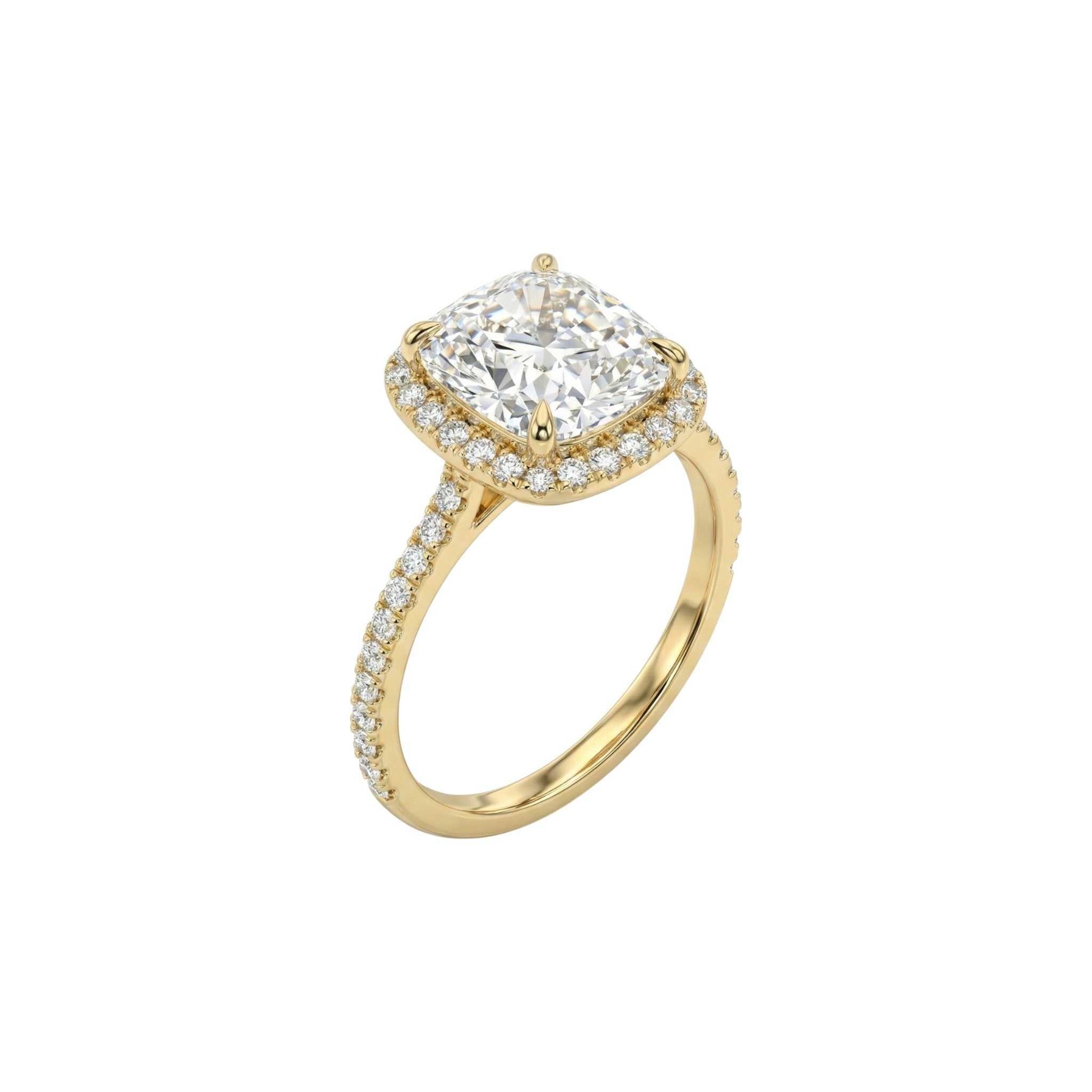 Gold ring with a large diamond and smaller diamonds on the band against a white background