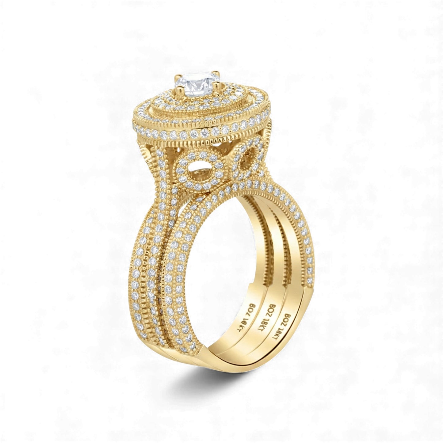 Gold ring with diamond accents on a white background