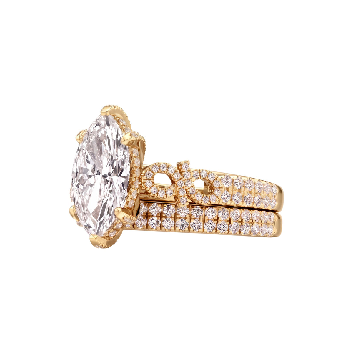 A yellow gold engagement ring set featuring a large oval-cut clear gemstone in a prong setting, with a matching pavé band ring behind it, shown on a plain white background.