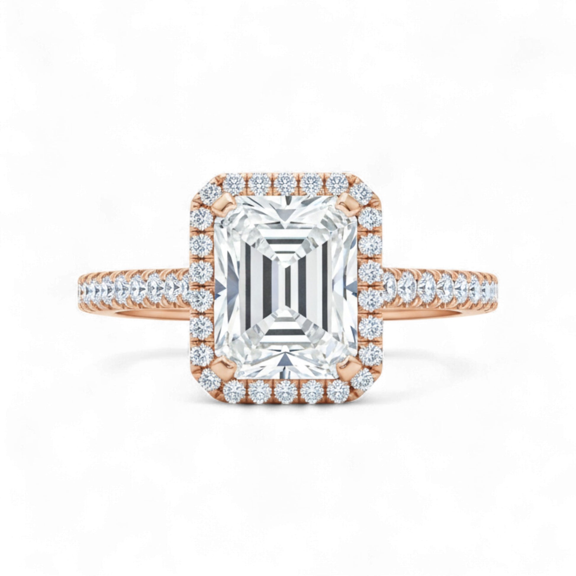 Rose gold and silver emerald-cut diamond ring with a white background
