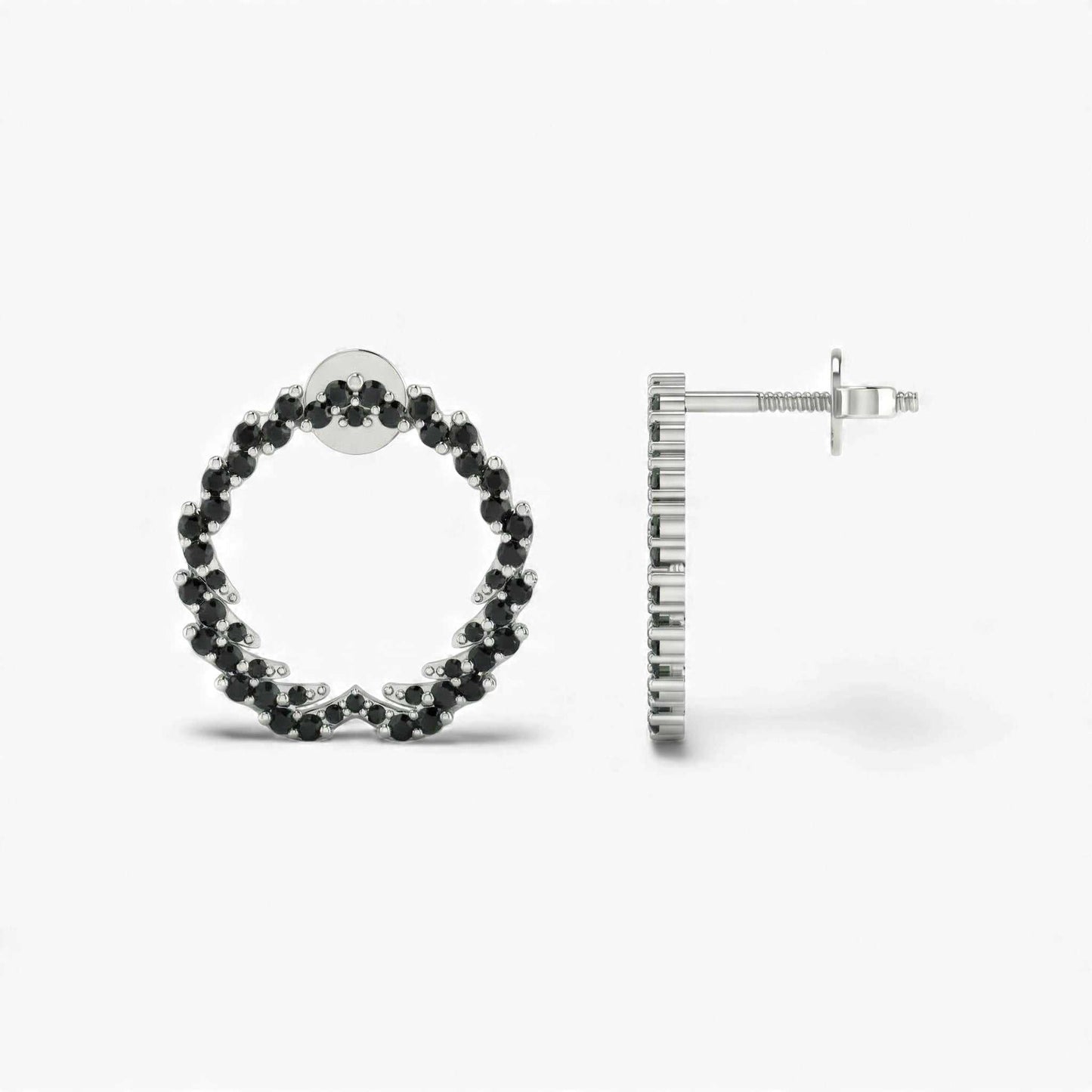 Hoop earrings with black gemstones on a white background