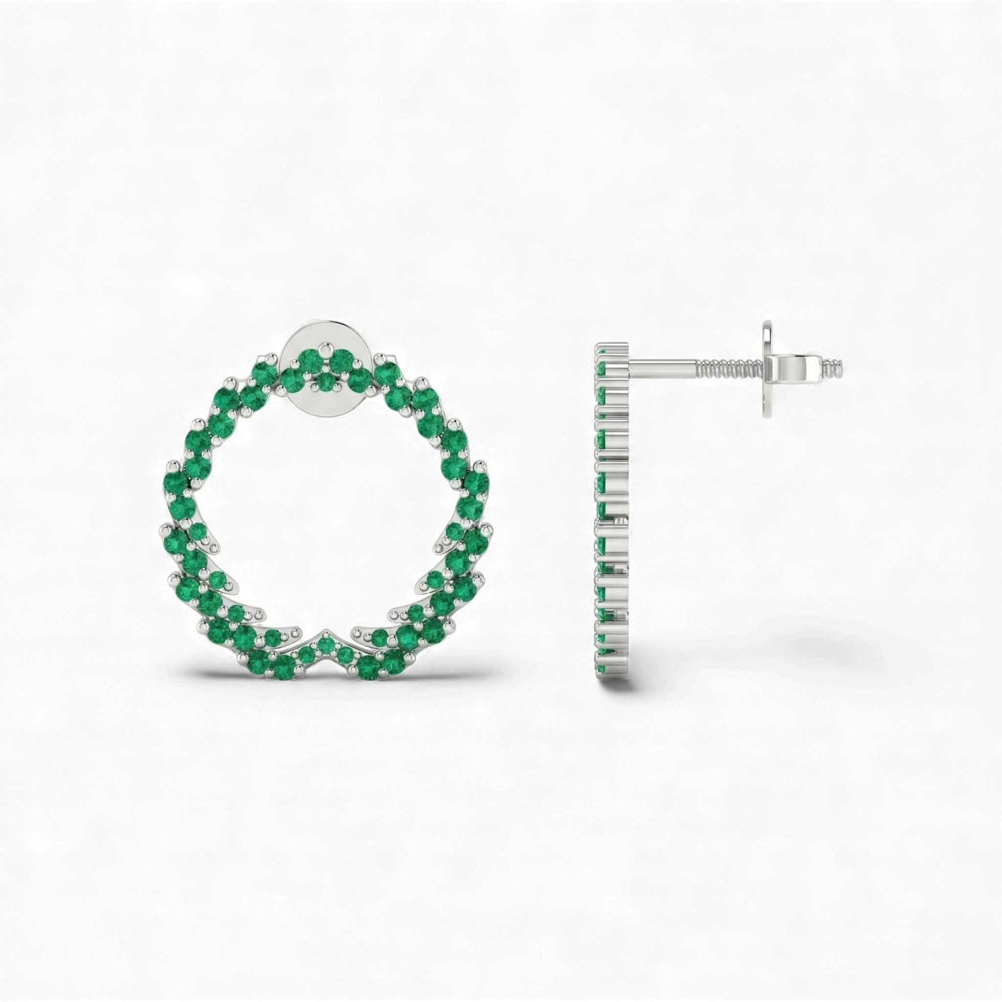 Hoop earrings with green gemstones on a white background