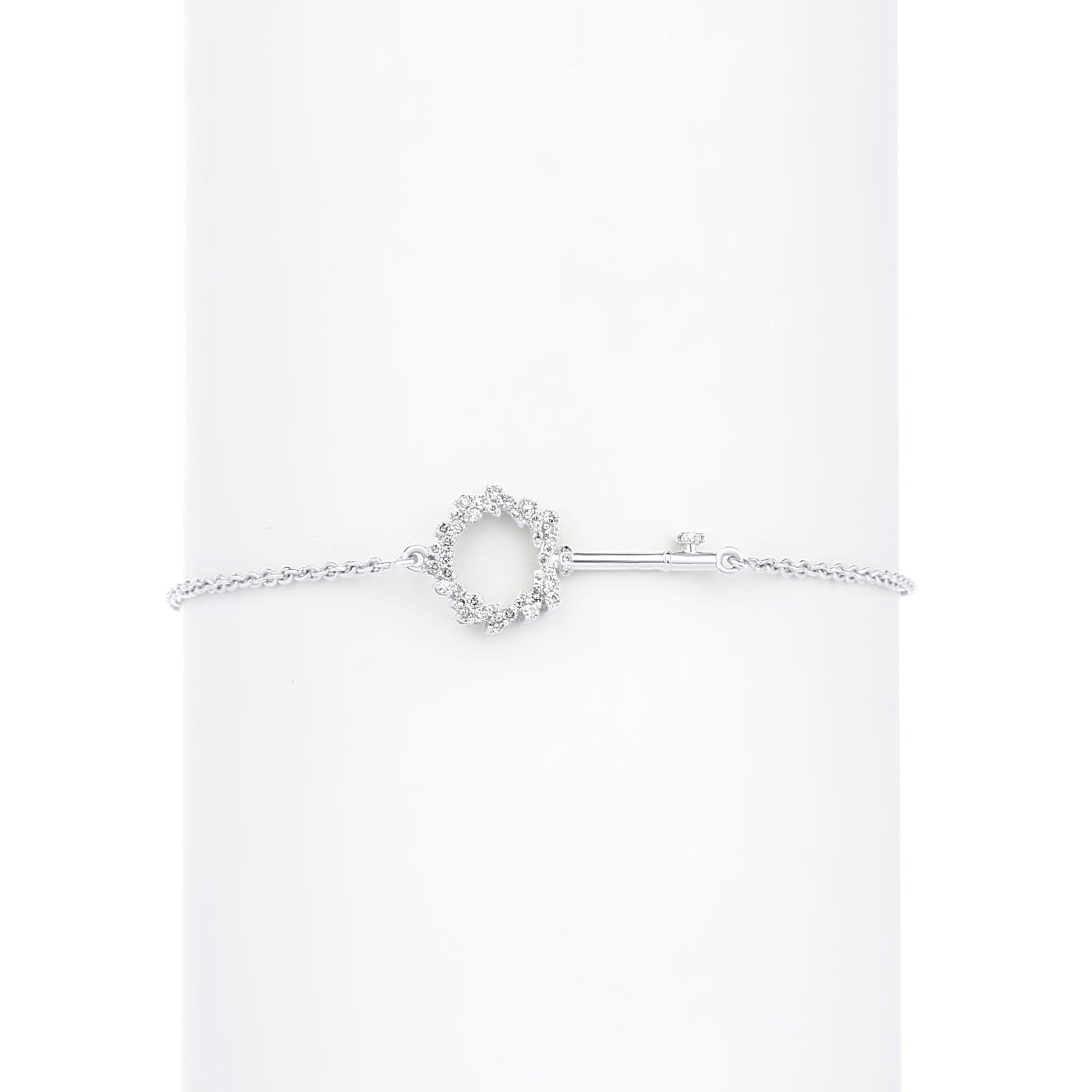 Silver bracelet with a heart-shaped clasp on a white background
