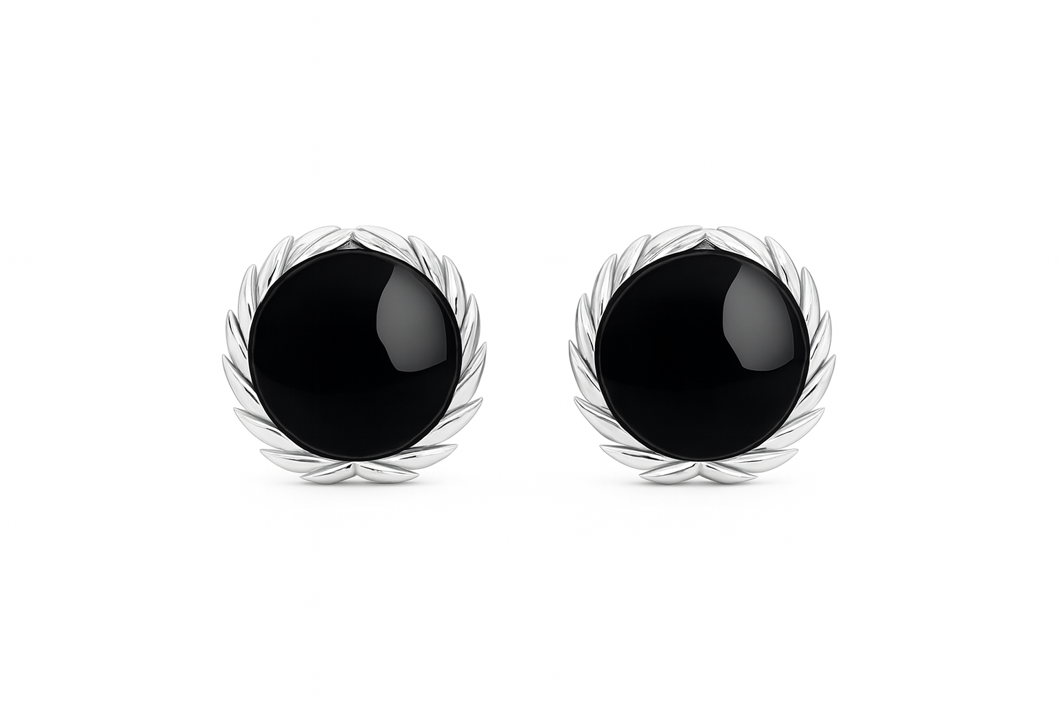 Pair of black earrings with silver leaf-like designs on a white background