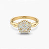 Gold ring with diamond cluster on a white background