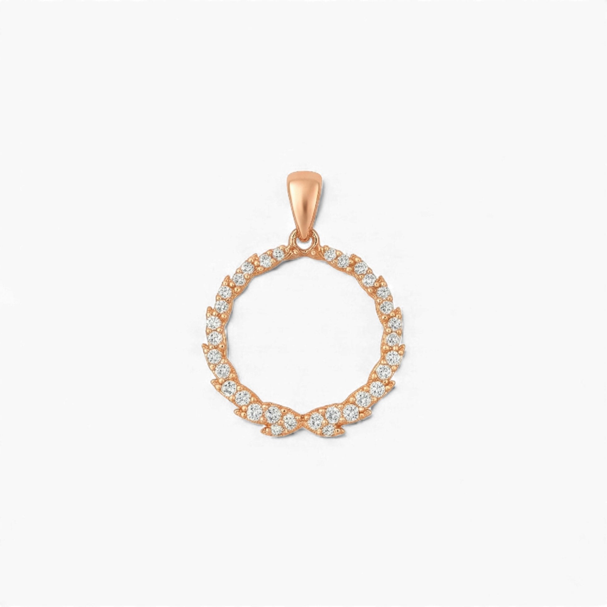 Rose gold pendant with diamond accents on a white background