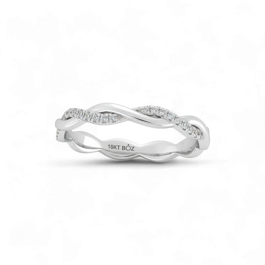 Silver ring with diamond accents on a white background