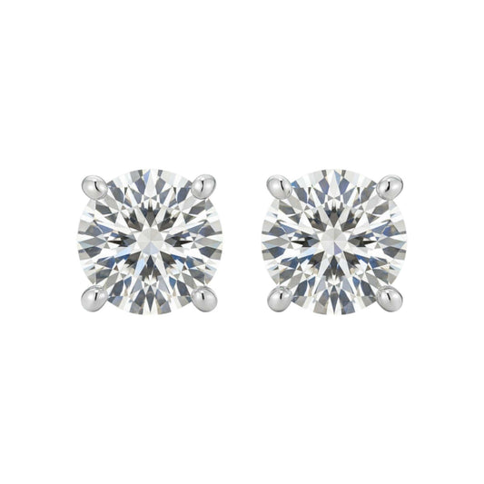 Pair of round diamond stud earrings on a white background