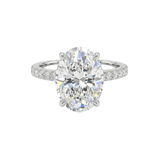 Diamond ring with a large central gemstone on a white background