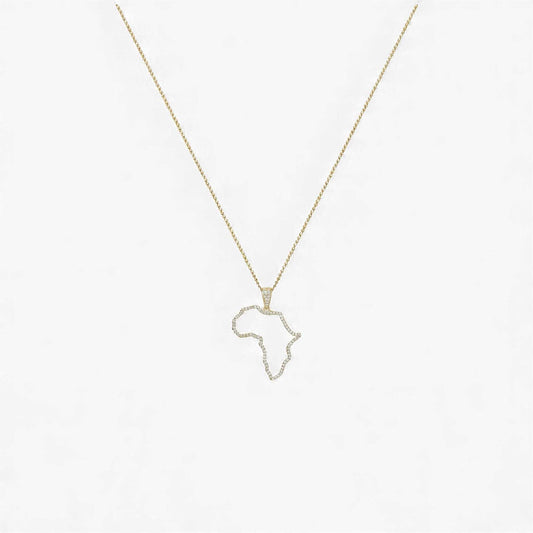 Gold necklace with a pendant shaped like the African continent on a light gray background