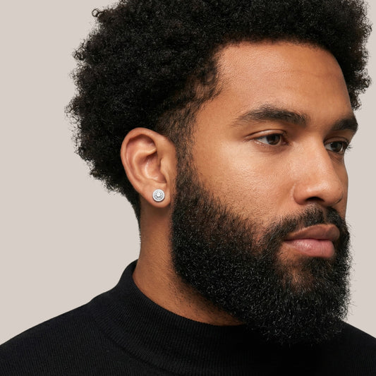 Man wearing a black turtleneck with a neutral background