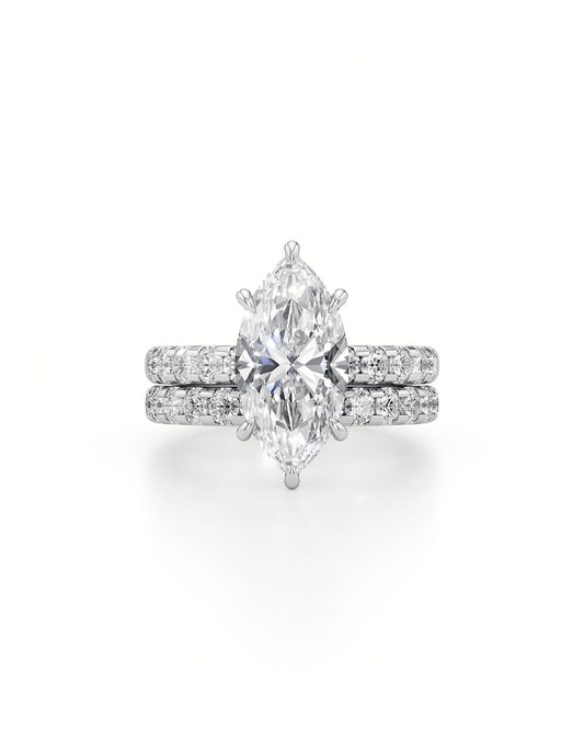 Diamond ring with pear-shaped center stone on a white background