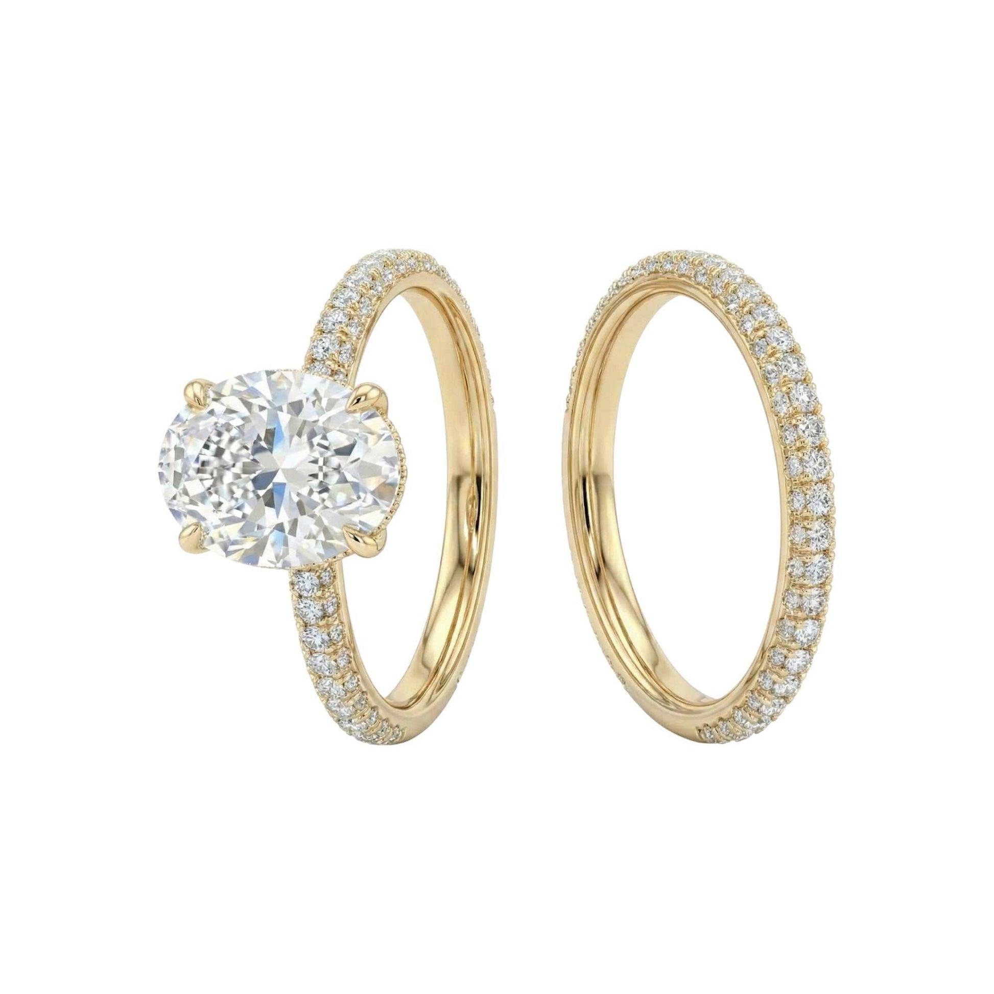 Gold ring with a diamond and another gold ring on a white background