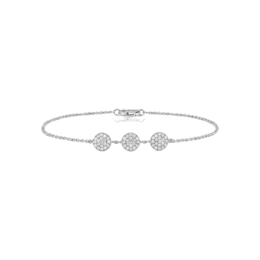 Silver bracelet with three round diamonds on a white background