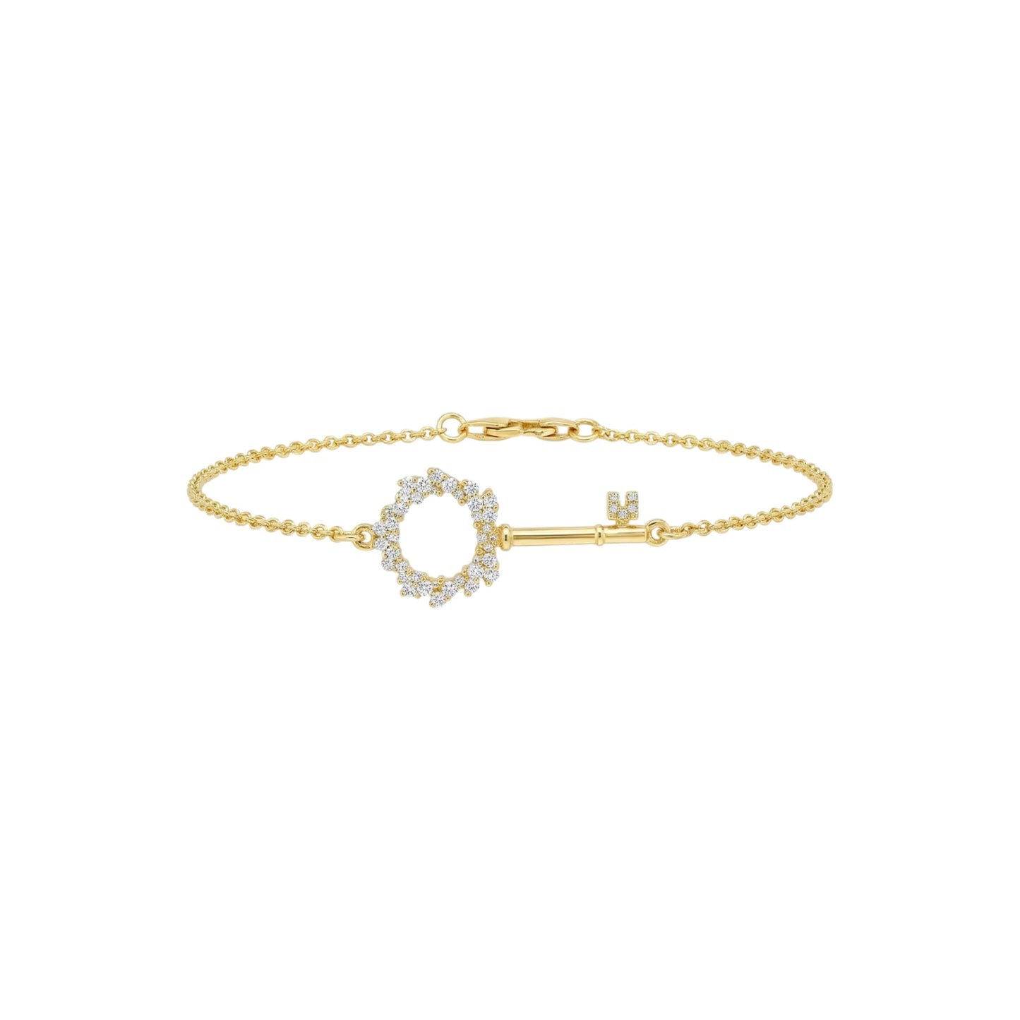 Gold bracelet with a key-shaped clasp on a white background