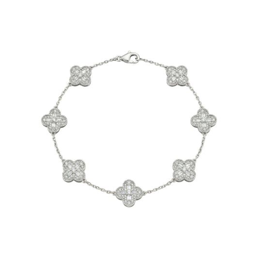 Silver bracelet with clover-shaped charms on a white background