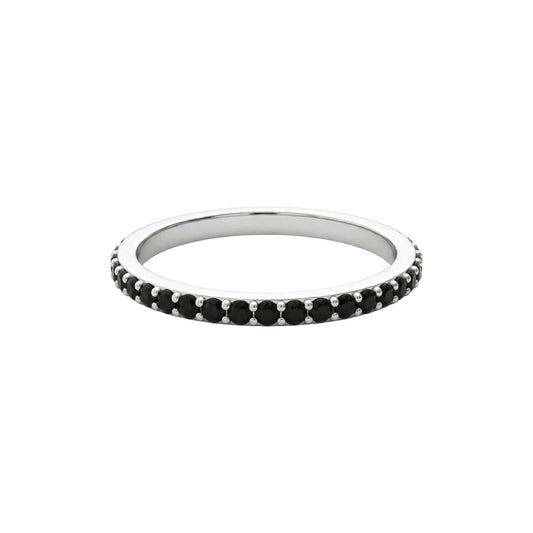 Silver ring with black gemstones on a white background