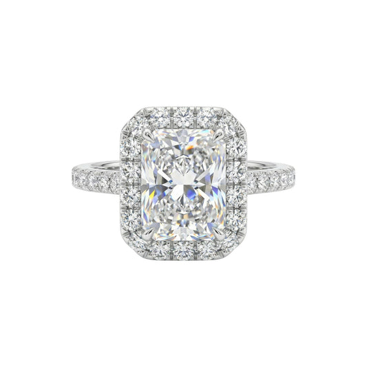 Diamond ring with a cushion-cut center stone on a white background