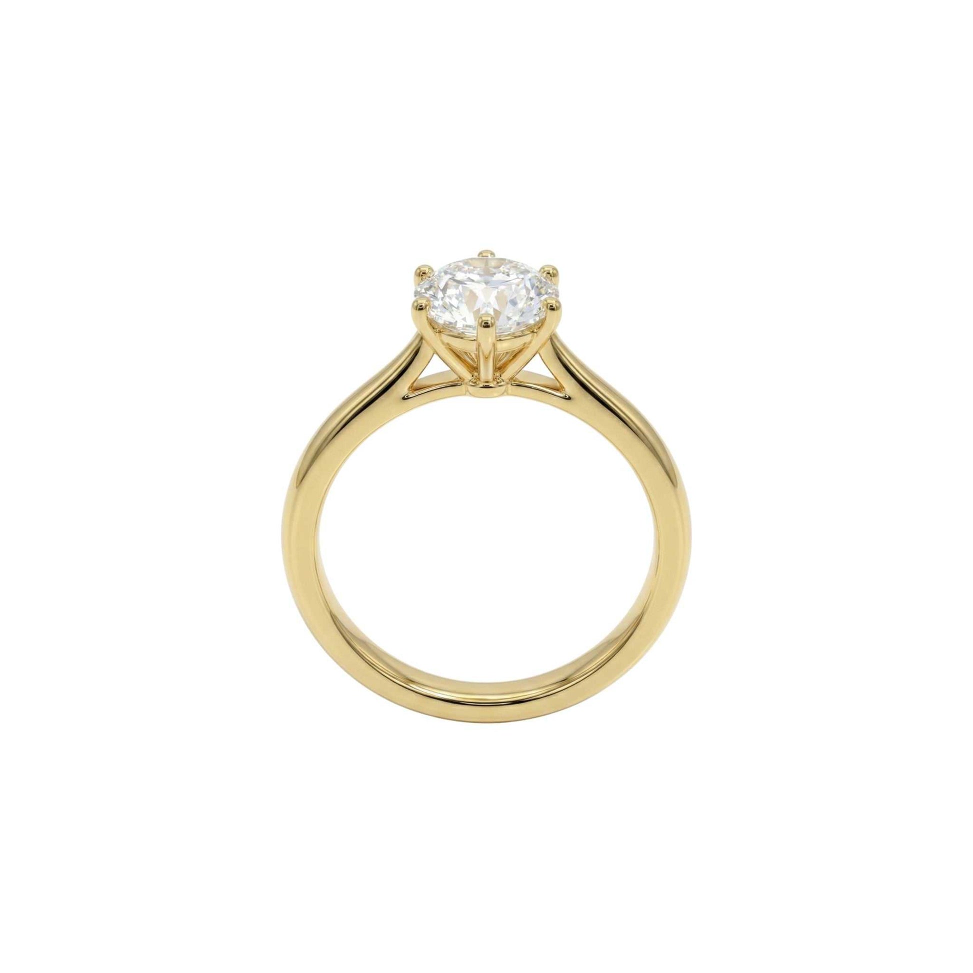 Gold ring with a diamond on a white background