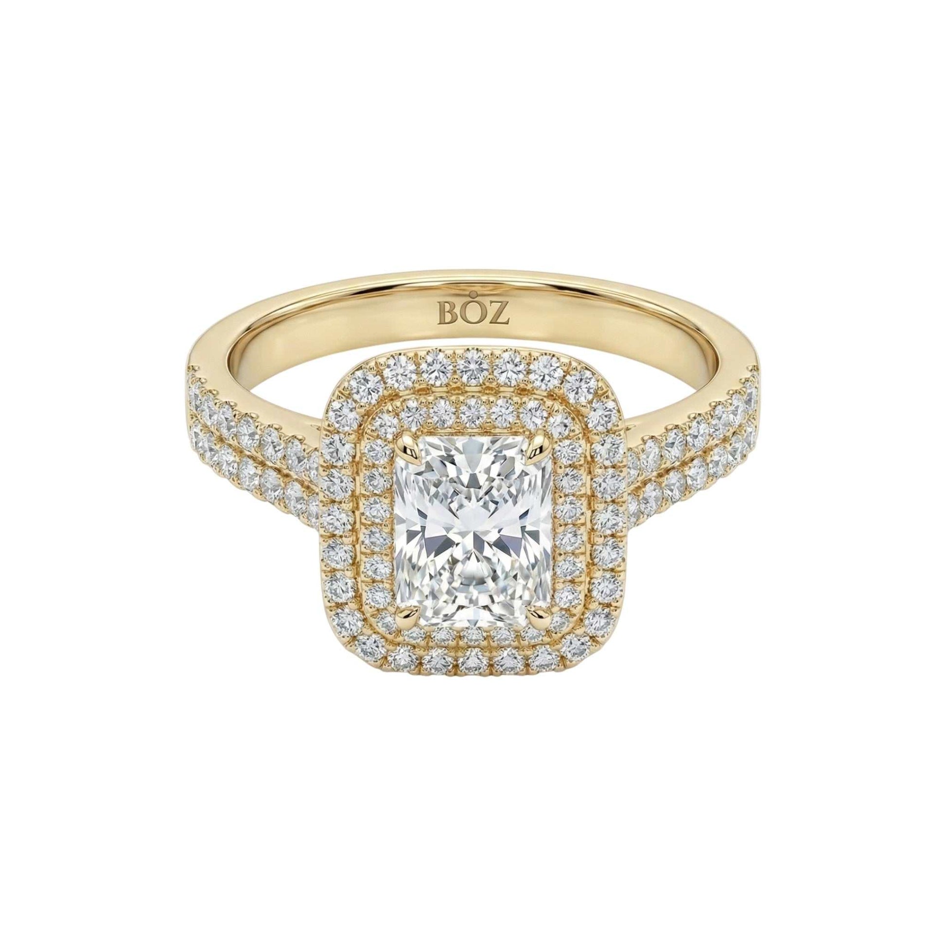 Gold ring with a large diamond and smaller diamonds on a white background