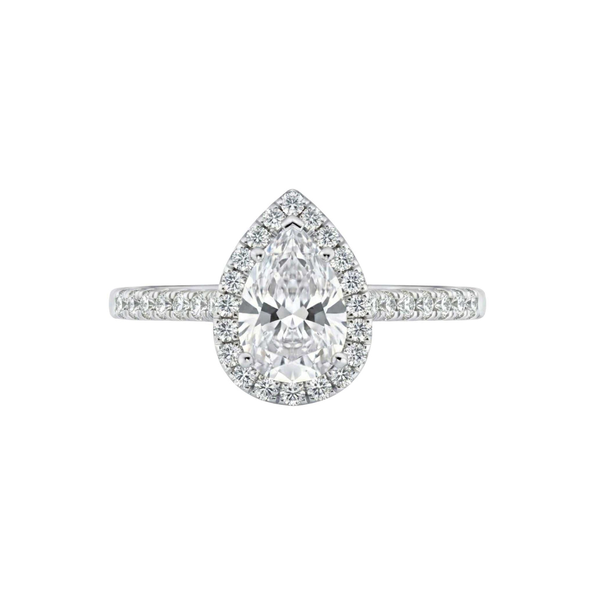Diamond ring with pear-shaped center stone on a white background