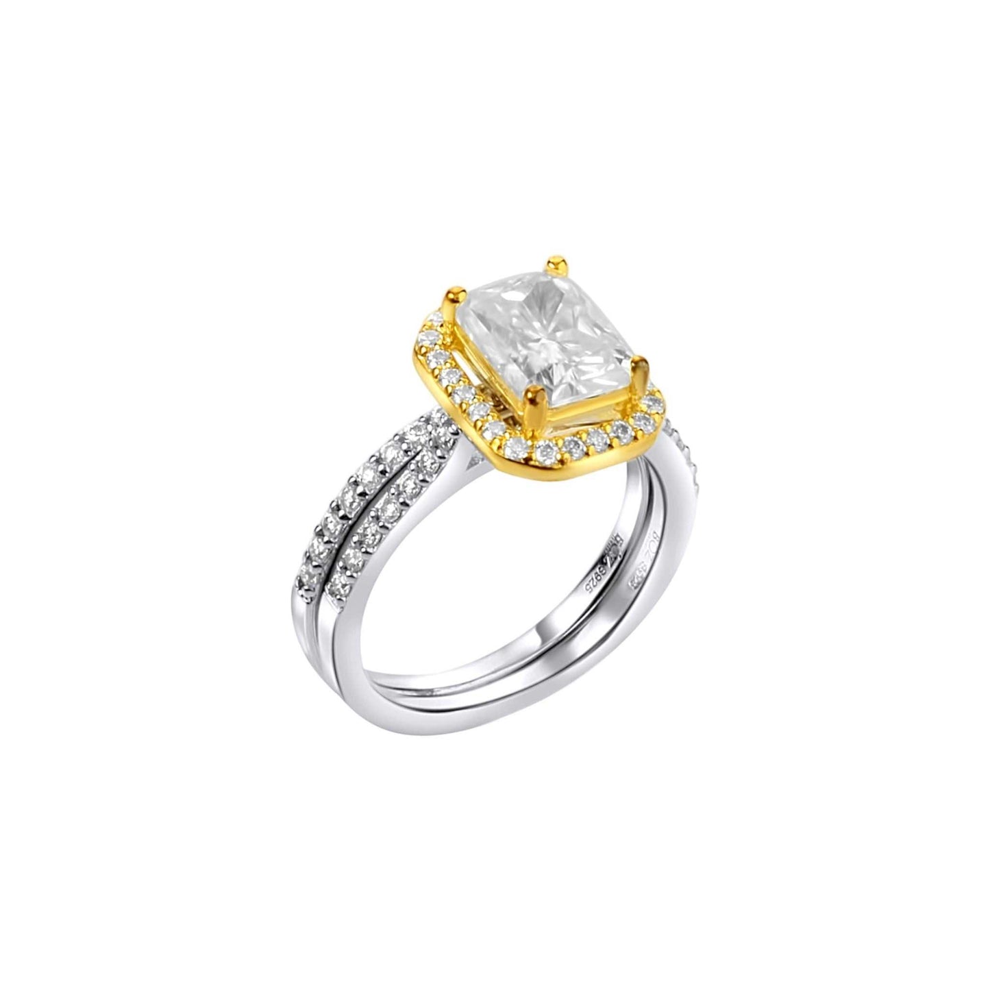 Gold and silver ring with a large diamond on a white background