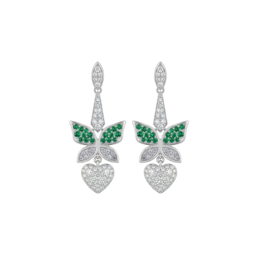 Butterfly-shaped earrings with green gemstones and heart details on a white background