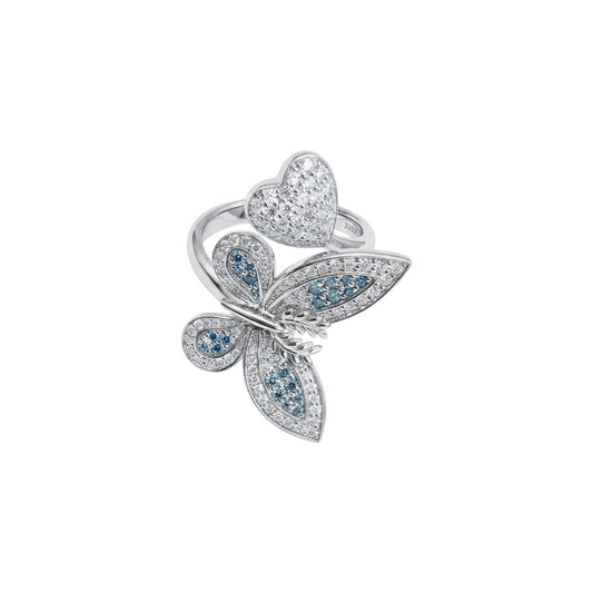 Butterfly-shaped ring with gemstones on a white background