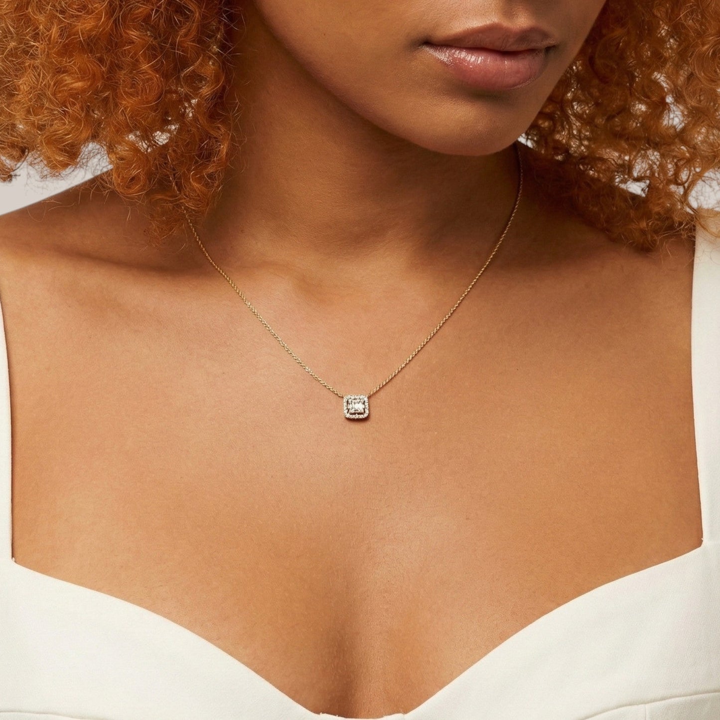 Necklace with a pendant worn by a person