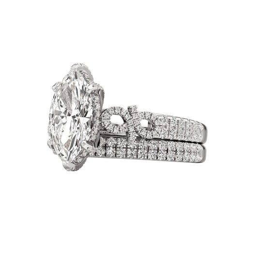 Diamond ring with a matching band on a white background