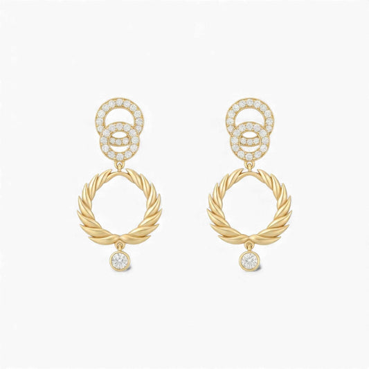 Gold earrings with interlocking rings and small diamonds on a white background